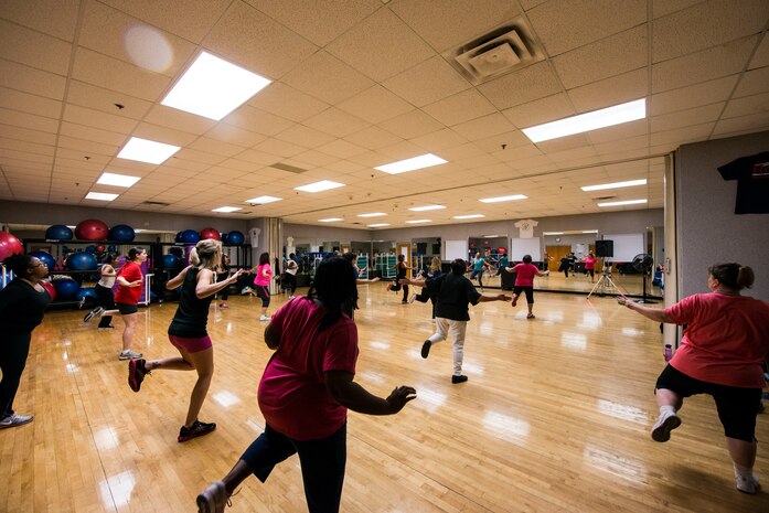 Participants perform dance fitness during a Zumba class Feb. 27, 2013, at the Joint Base Charleston - Air Base Fitness Center. Zumba involves dance and aerobic elements, incorporating Hip-hop, Soca, Samba, Salsa, Merengue, Mambo, martial arts, and some Bollywood and belly dance moves. The Zumba classes are held 4:35 to 5:35 p.m. on Mondays; noon to 1 p.m. on Tuesdays; 11 to 11:50 a.m. and 4:35 to 5:35 p.m. on Wednesdays; noon to 1 p.m. and 7 to 8 p.m. on Thursdays; 4:35 to 5:35 p.m. on Fridays and 9:30 to 10:30 a.m. on Saturdays. (U.S. Air Force photo/ Senior Airman George Goslin)
