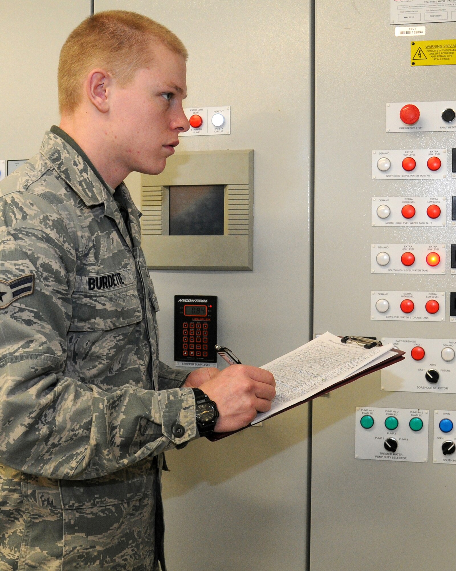 Airman 1st Class Andrew Burdette, 100th Civil Engineer Squadron Water and Fuels Maintenance journeyman from Victorville, Calif., reads the main booster pump meters to ensure the base’s water treatment plant is operating properly Feb. 28, 2013, at RAF Mildenhall, England. The shop inspects and performs preventative maintenance on all fire prevention systems and fire hydrants, along with maintaining base facilities’water and wastewater systems. This process ensures the base has fully operational utilities. (U.S. Air Force photo by Gina Randall/Released)