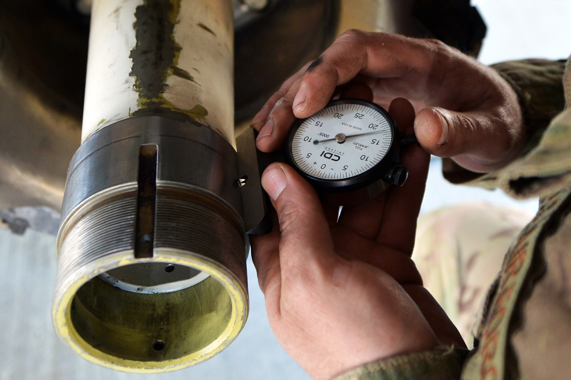 Staff Sgt. Joshua Willingham, 455th Expeditionary Aircraft Maintenance Squadron crew chief, checks the landing gear on a C-130 Hercules  on Bagram Airfield, Afghanistan, March 6, 2013.  The 455th EAMXS is responsible for preparing military aircraft on Bagram for flight and returning them to a mission-ready state once they land. (U.S. Air Force photo/Senior Airman Chris Willis)