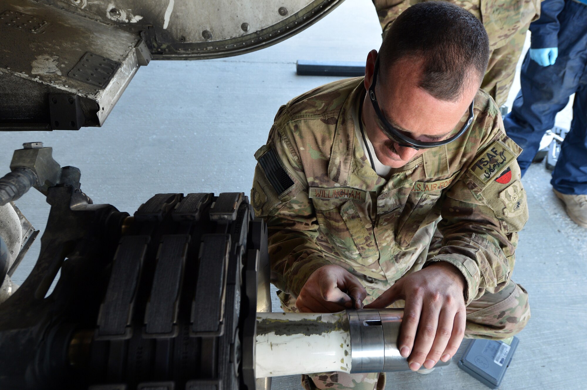 Staff Sgt. Joshua Willingham, 455th Expeditionary Aircraft Maintenance Squadron crew chief, checks the landing gear on a C-130 Hercules  on Bagram Airfield, Afghanistan, March 6, 2013.  The 455th EAMXS is responsible for preparing military aircraft on Bagram for flight and returning them to a mission-ready state once they land. (U.S. Air Force photo/Senior Airman Chris Willis)