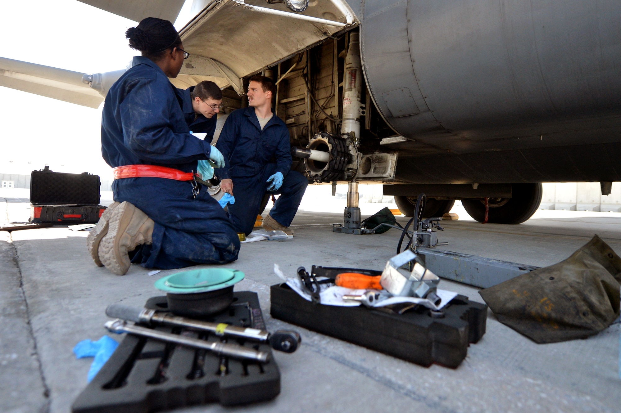Crew chiefs assigned to the 455th Expeditionary Aircraft Maintenance Squadron replace a tire on a C-130 Hercules on Bagram Airfield, Afghanistan, March 6, 2013.  The crew is deployed from Little Rock Air Force Base, Ark., in support of Operation Enduring Freedom.   (U.S. Air Force photo/Senior Airman Chris Willis)