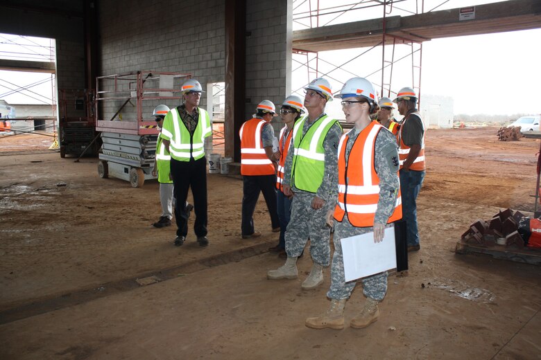 1st. Lt. Diana Worth (right) briefs Maj. Gen.Kendall Cox, U.S. Army Corps of Engineers deputy commanding general for Military and International Operations (front, left) on South Range facilities during an on-site briefing in Oct. 2012.