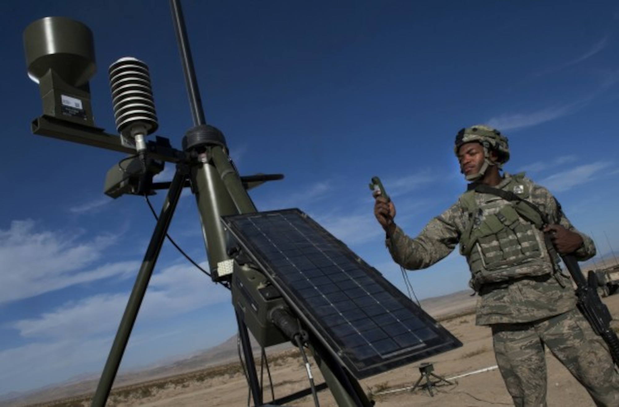 Bagram Air Base, Afghanistan -- Senior Airman Michael Richardson takes weather readings with a TMQ-53 tactical weather sensor during training at Fort Irwin, Calif. Richardson is a battlefield weather forecaster assigned to the 3rd Weather Squadron at Fort Riley, Kan. (U.S. Air Force photo/Val Gempis)
