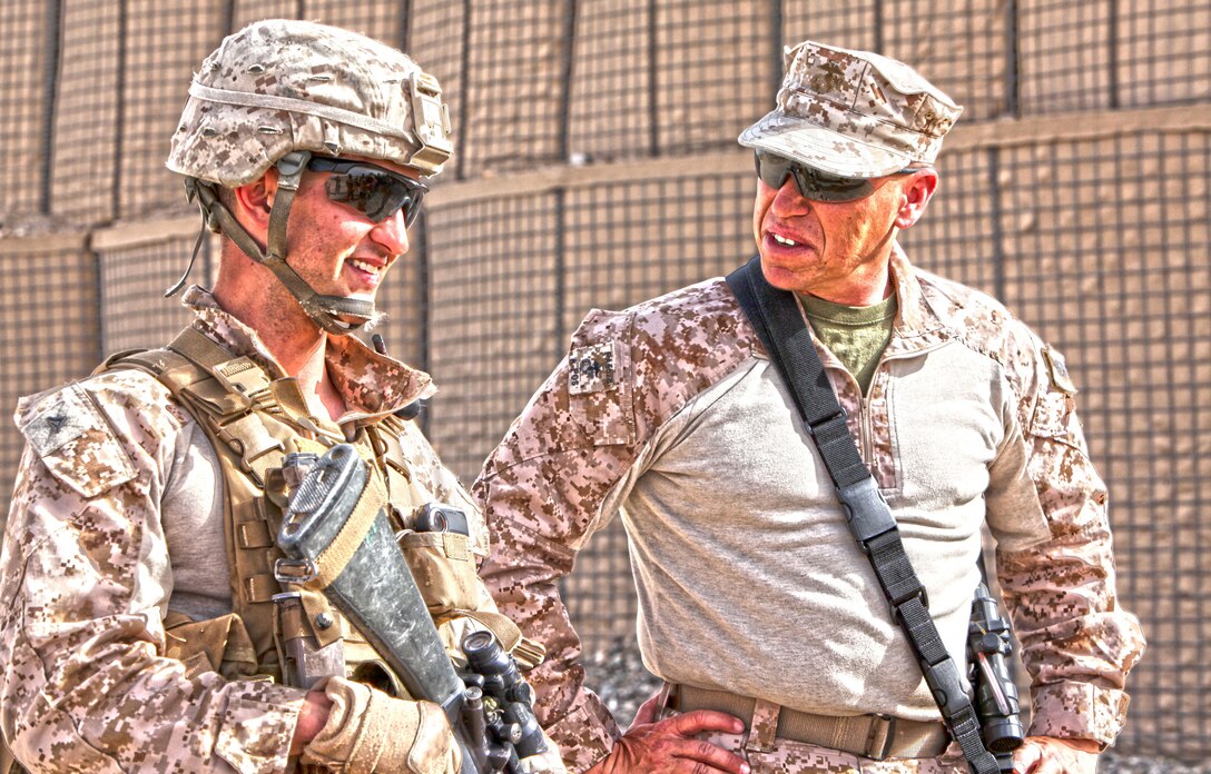 Regional Command Southwest Commanding General Maj. Gen. Lee Miller, Sgt. Maj. Paul Berry, and Command Master Chief Kelly McNulty visits with the Marines of Weapons Company, 2nd Battalion, 7th Marine Regiment at Patrol Base Boldak March 6. The command staff visited the Marines in part to see the daily operations at Boldak, as well as to talk with the junior Marines. (High Dynamic Range Photo by Sgt. Bobby J. Yarbrough)
