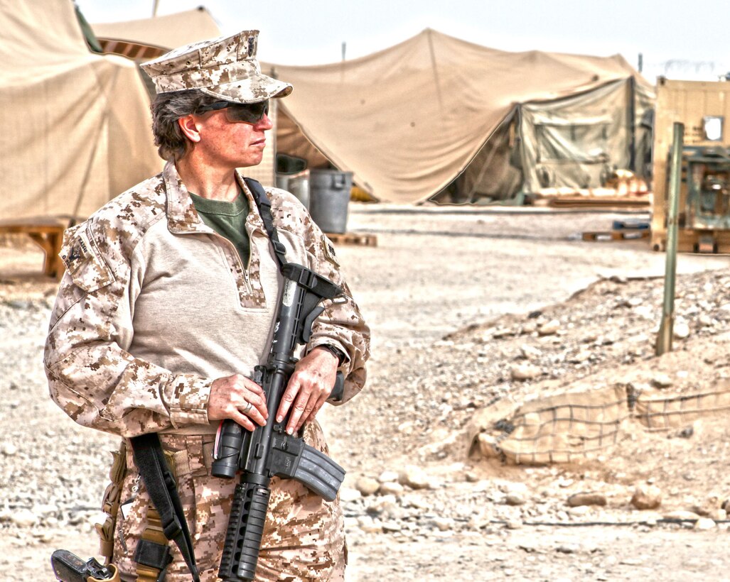 Regional Command Southwest Commanding General Maj. Gen. Lee Miller, Sgt. Maj. Paul Berry, and Command Master Chief Kelly McNulty visits with the Marines of Weapons Company, 2nd Battalion, 7th Marine Regiment at Patrol Base Boldak March 6. The command staff visited the Marines in part to see the daily operations at Boldak, as well as to talk with the junior Marines. (High Dynamic Range Photo by Sgt. Bobby J. Yarbrough)