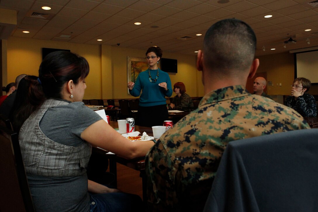 Becky Salazar, Marine Corps Community Services LifeSkills trainer, speaks to couples during a Things I Wish I’d Known Before I Got Married workshop at Afterburners, Feb. 26. The workshop teaches young couples about family dynamics and how it can affect behavioral tendencies in relationships. 