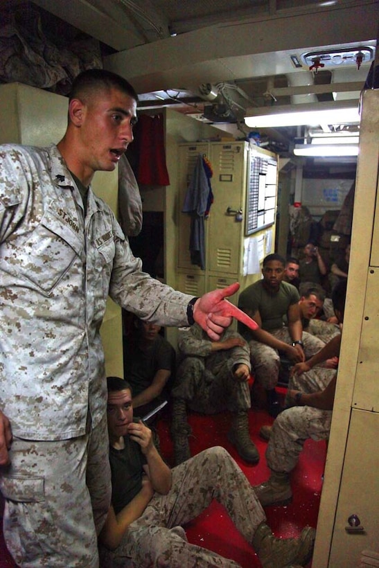 Sergeant Angelo St John, squad leader, 2nd Platoon, Battery B, Battalion Landing Team 3/5, 15th Marine Expeditionary Unit, teaches a class on physical fitness and nutrition aboard USS Rushmore, March 5. The 15th MEU is deployed as part of the Peleliu Amphibious Ready Group as a U.S. Central Command theater reserve force, providing support for maritime security operations and theater security cooperation efforts in the U.S. 5th Fleet area of responsibility. (U.S. Marine Corps photo by Cpl. Timothy R. Childers/Released)