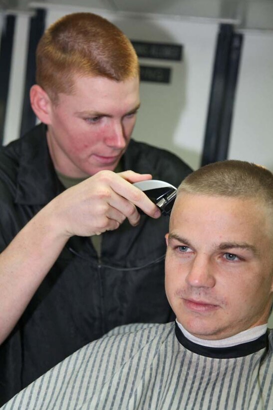 Lance Cpl. Jeffrey C. Cook, fire direction controller, 2nd Platoon, Battery B, Battalion Landing Team 3/5, 15th Marine Expeditionary Unit, gives a haircut to Lance Cpl. Zachery W. Short, a field artillery cannoneer in the same platoon, aboard the USS Rushmore, March, 7.  While deployed, Marines practiced and honed the valuable skill of cutting hair taking the place of civilian barbers. The 15th MEU is deployed as part of the Peleliu Amphibious Ready Group as a U.S. Central Command theater reserve force, providing support for maritime security operations and theater security cooperation efforts in the U.S. 5th Fleet area of responsibility. (U.S. Marine Corps photo by Cpl. Timothy R. Childers/Released)