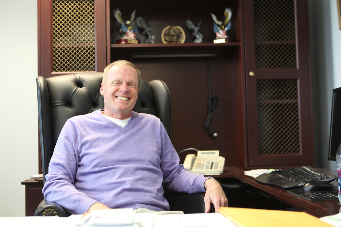 Richard Hine, a counsel at the East Area Counsel Office aboard Marine Corps Base Camp Lejeune, smiles while discussing his years working as a Marine and as a counsel Jan. 24. Hine served as an infantry officer, a judge advocate and as special assistant to the counsel of the commandant of the Marine Corps.