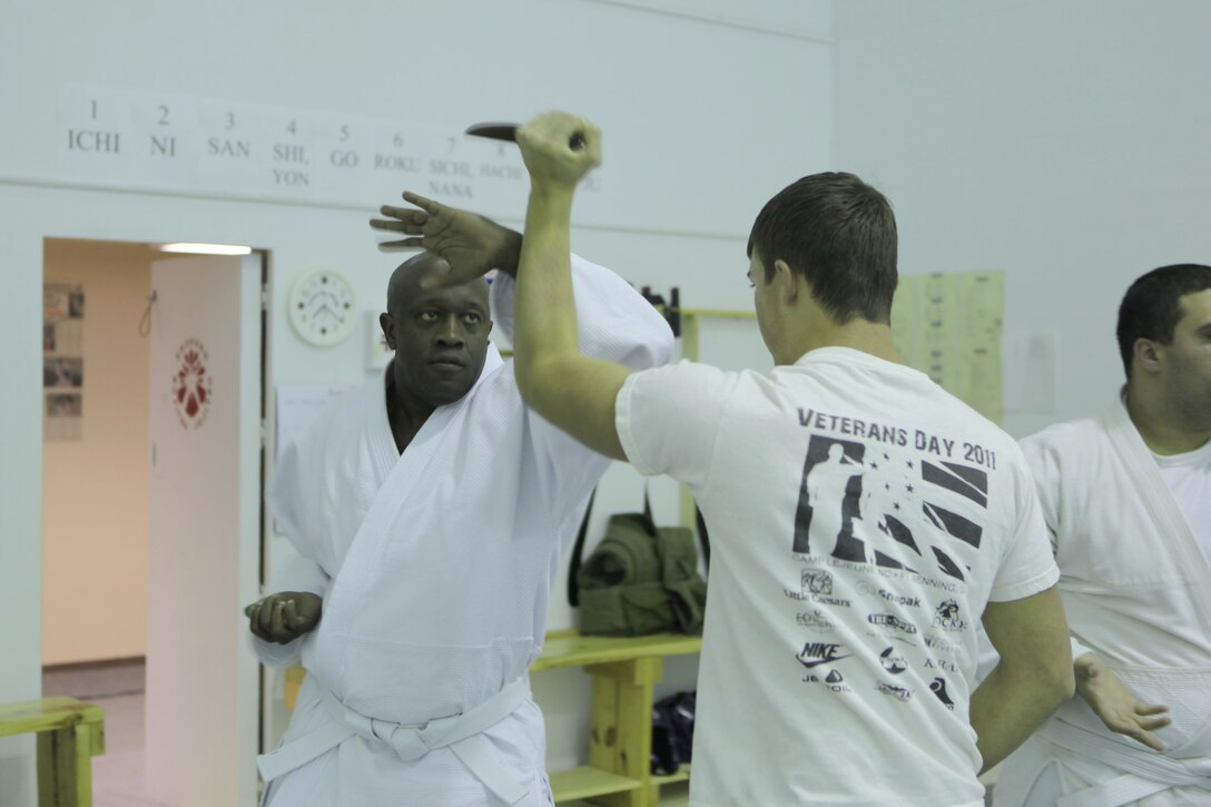 Wayne Nelson, the senior instructor of the Traditional Jujitsu Class aboard Marine Corps Base Camp Lejeune demonstrates technique on Xavier Turcotte, a seven year martial artist, Feb. 5. Nelson teaches methods of self defense to Marines, dependants, retirees and civilian employees twice a week at Building 39, next to the Goettge Memorial Field House aboard the base.

