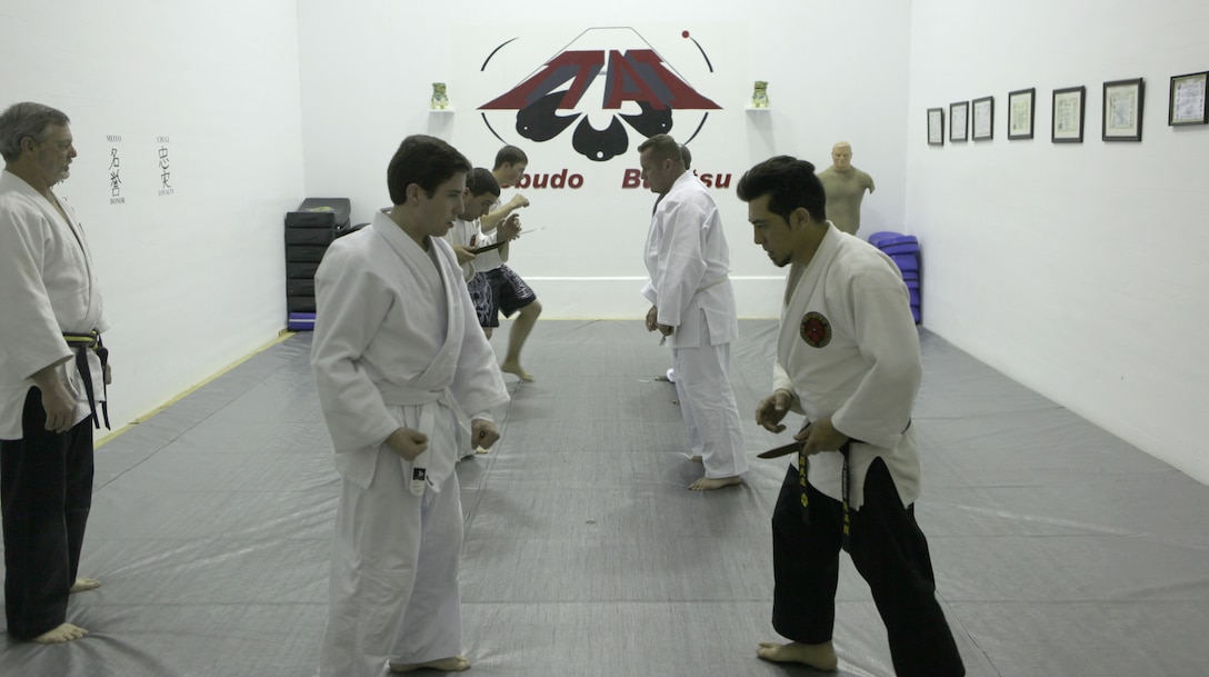 Wayne Nelson, the senior instructor of the Traditional Jujitsu Class aboard Marine Corps Base Camp Lejeune demonstrates technique on Xavier Turcotte, a seven year martial artist, Feb. 5. Nelson teaches methods of self defense to Marines, dependants, retirees and civilian employees twice a week at Building 39, next to the Goettge Memorial Field House aboard the base.
