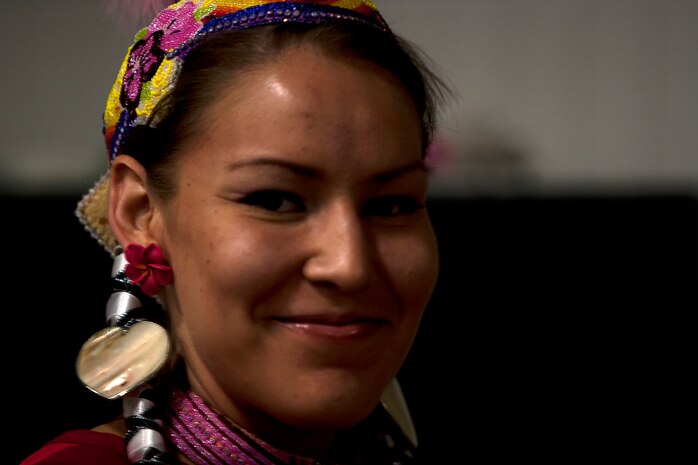 MARINE CORPS BASE HAWAII - Abriel Johnny-Rodriguez, a Native American “jingle dress” dancer, before performing a dance during Cultural Heritage Day at Kahuna’s Ballroom on Marine Corps Base Hawaii, March 1. The event, which will be held annually, highlights America’s diversity and common heritage on MCB Hawaii. (U.S. Marine Corps photo by Lance Cpl. Suzanna Lapi) 