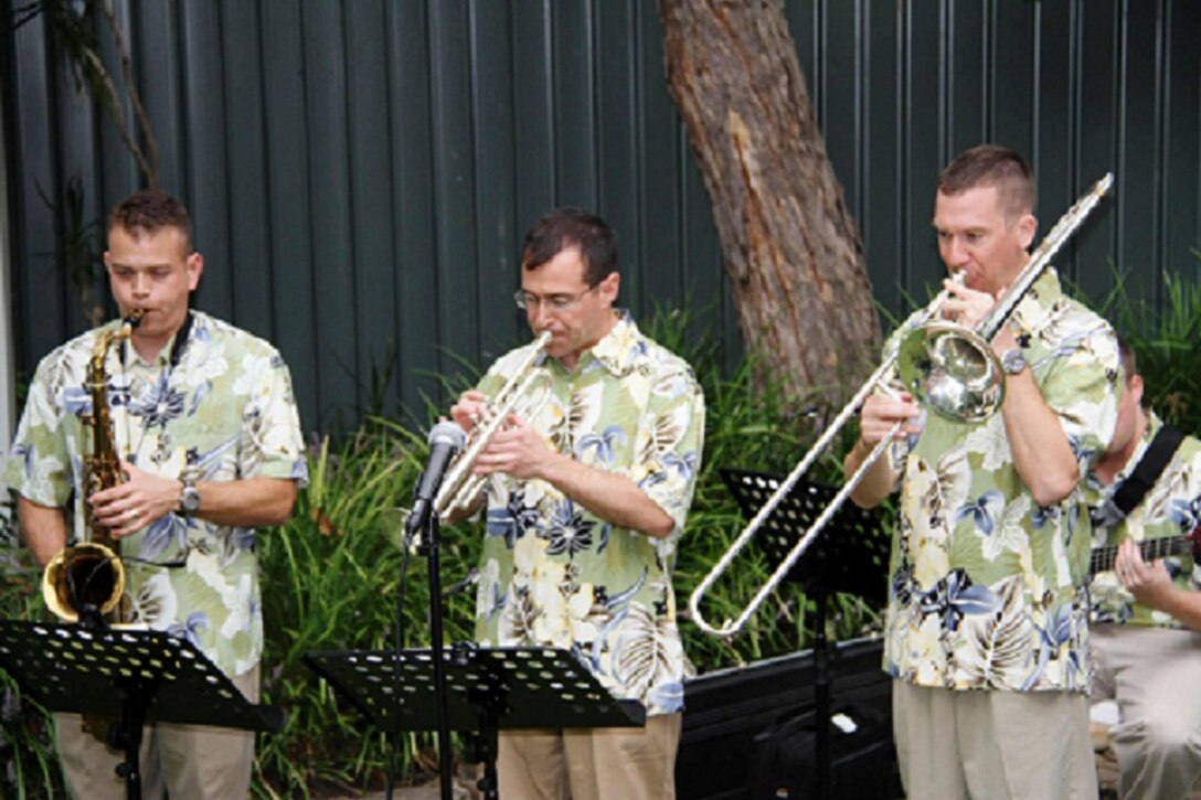 SSgt Miles Hudlow (saxaphone), TSgt Dave Diamond (trumpet), and TSgt Ben Kadow (trombone). 

Photographer: Micheal J. Pausic 