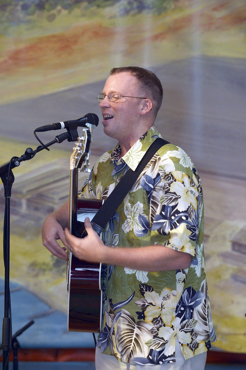 SrA Plank on acoustic bass guitar and vocals!  

Photographer: Micheal J. Pausic 