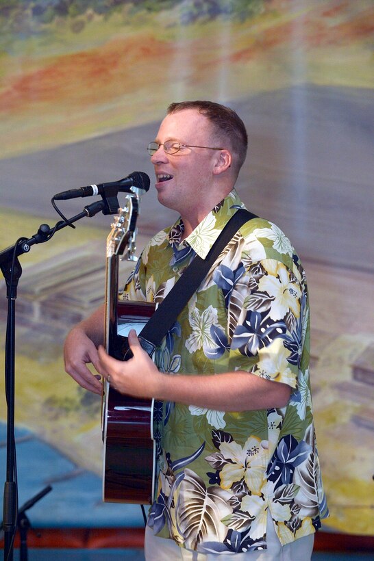 SrA Plank on acoustic bass guitar and vocals!  

Photographer: Micheal J. Pausic 