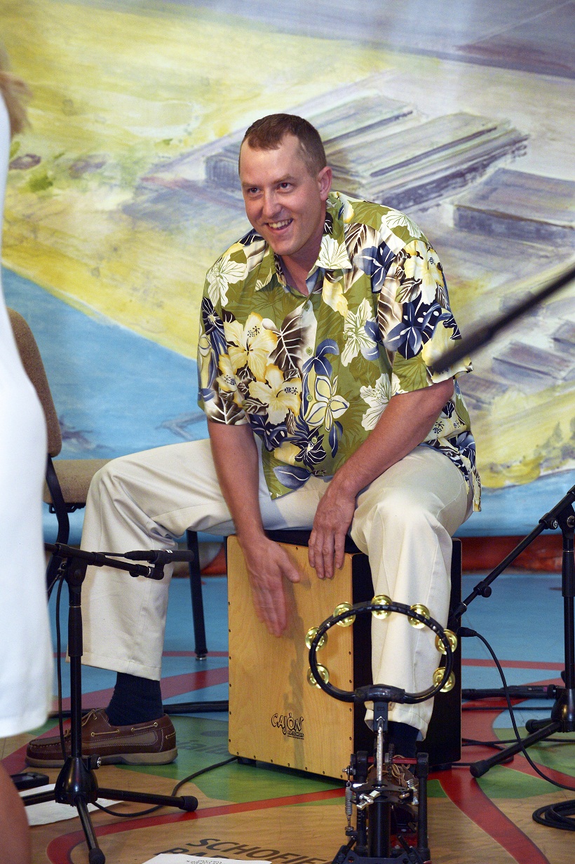 SSgt B.J. Fine keeps the beat on the cajon.

Photographer: Micheal J. Pausic 