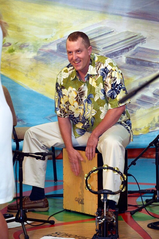 SSgt B.J. Fine keeps the beat on the cajon.

Photographer: Micheal J. Pausic 