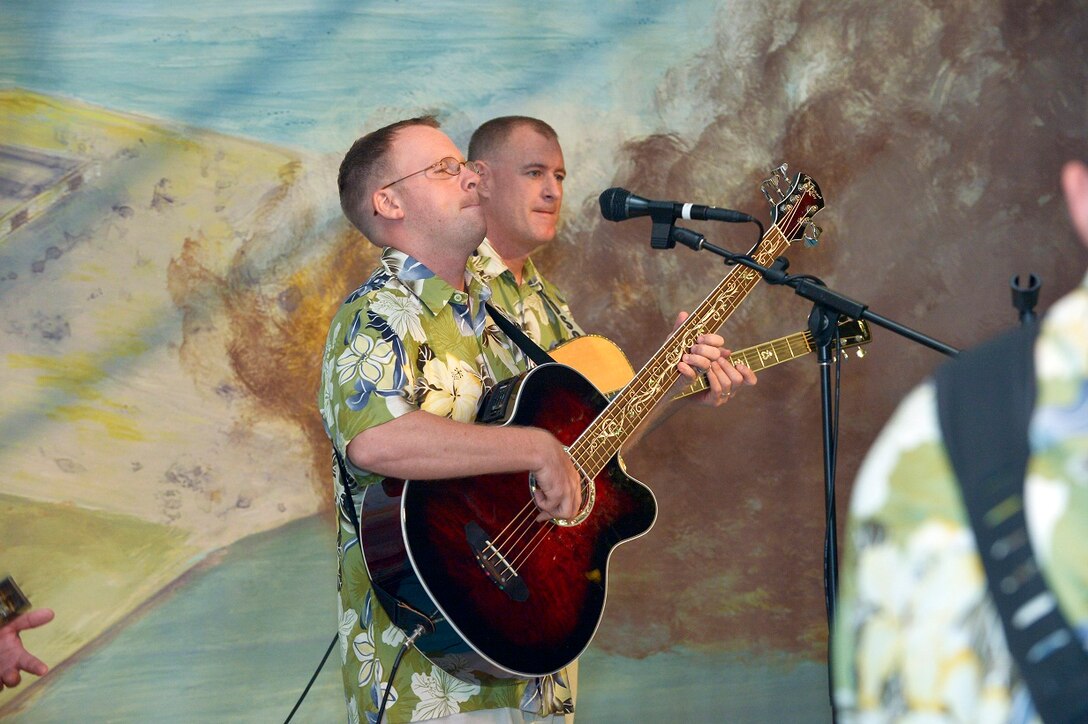 (S) SMSgt Gary Noel and SrA Brian Plank play acoustic guitar and bass. 

Photographer: Micheal J. Pausic 