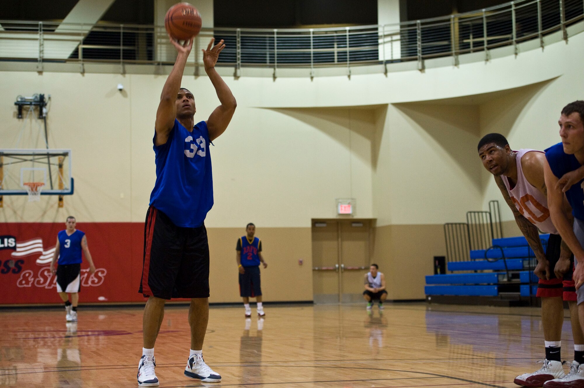 Kendal Dismute, 99th Civil Engineer Squadron, shoots a free throw during the intramural basketball championship game against the 57th Aircraft Maintenance Squadron Mar. 7, 2013, at Nellis Air Force Base, Nev. The 99th CES had a record of 6 wins and 2 losses going into the playoffs. (U.S. Air Force photo by Airman 1st Class Christopher Tam)