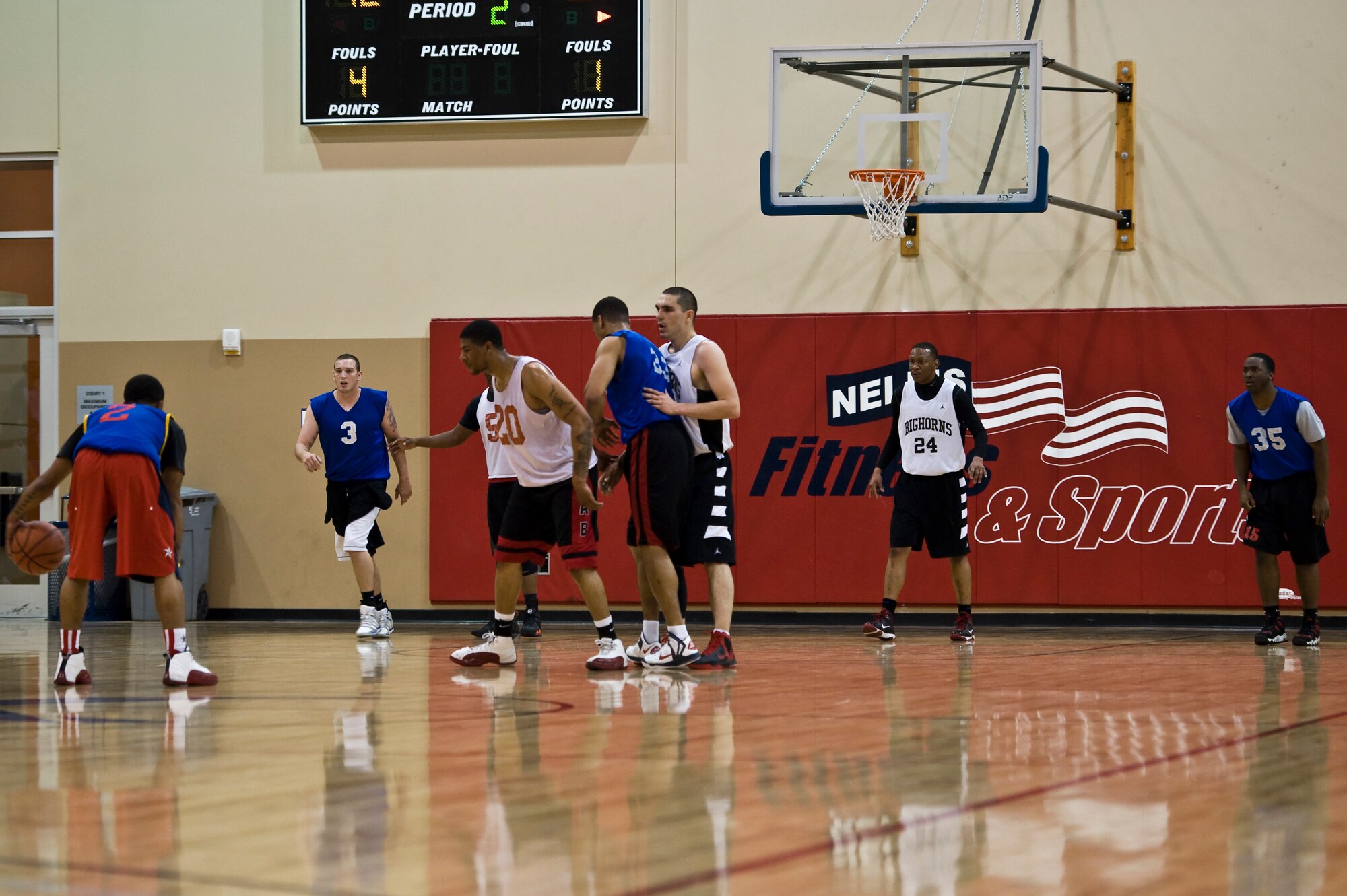 The 99th Civil Engineer Squadron intramural basketball team has possession of the ball during the championship game against the 57th Aircraft Maintenance Squadron Mar. 7, 2013, at Nellis Air Force Base, Nev. With a total of 27 teams that participated in this season, the 99th CES was the seventh overall seed, and the 57th AMXS was the second seed. (U.S. Air Force photo by Airman 1st Class Christopher Tam)