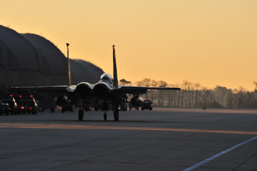 An F-15E Strike Eagle taxis on the flight line prior to take-off at a simulated deployed location during Operational Readiness Inspection CORONET WHITE on Seymour Johnson Air Force Base, N.C., Mar. 8, 2013. Aircrew members and maintainers worked during fluctuating alarm conditions and mission oriented protective postures to ensure mission success. (U.S. Air Force photo/Airman 1st Class Aubrey White/Released)
