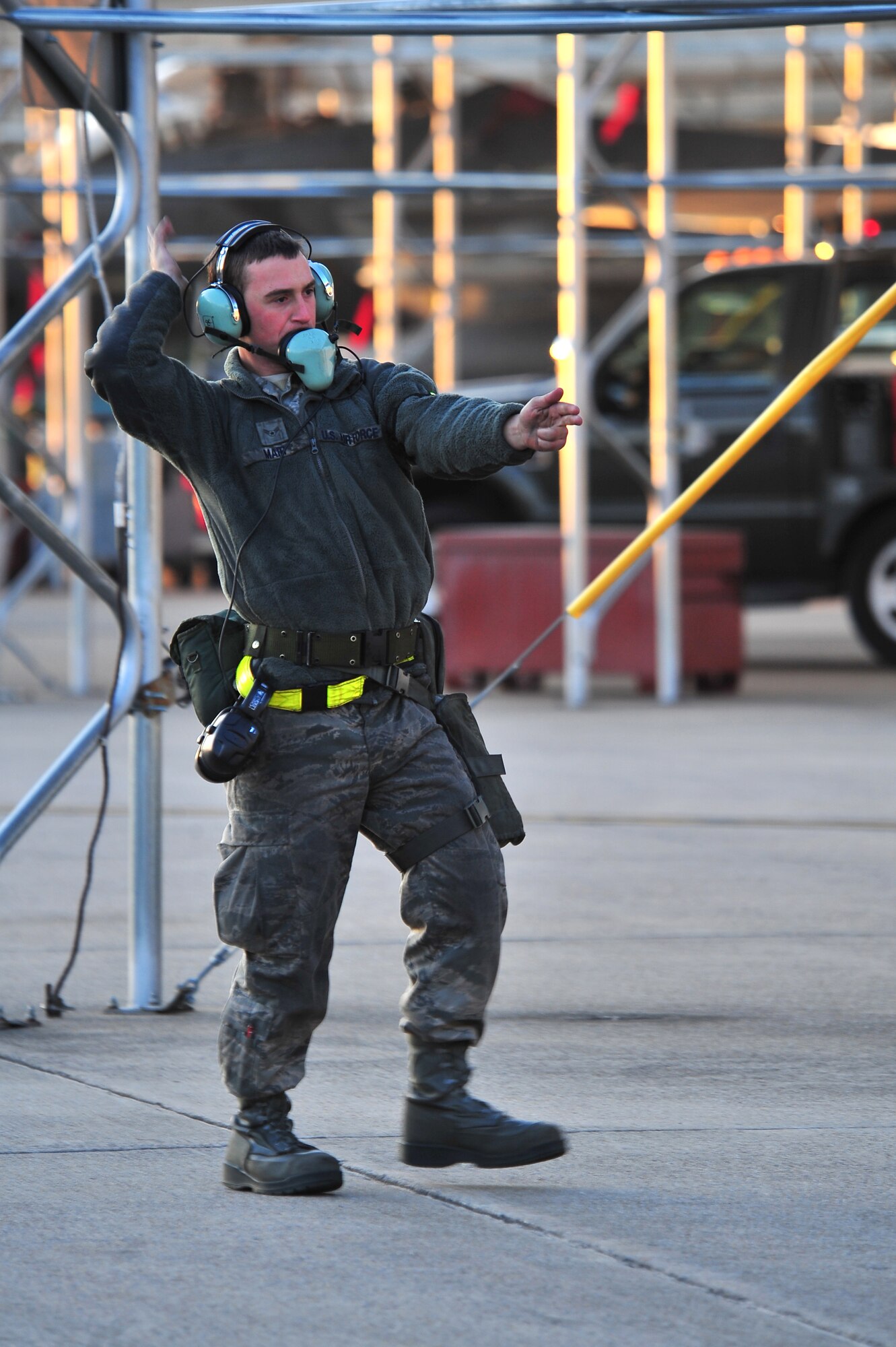 U.S. Air Force Airman 1st Class Jason Mair, 4th Aircraft Maintenance Squadron crew chief, signals for an aircraft to taxi on the flight line during Operational Readiness Inspection CORONET WHITE on Seymour Johnson Air Force Base, N.C., Mar. 8, 2013. Aircrew members and maintainers worked during fluctuating alarm conditions and mission oriented protective postures to ensure mission success. (U.S. Air Force photo/Airman 1st Class Aubrey White/Released)