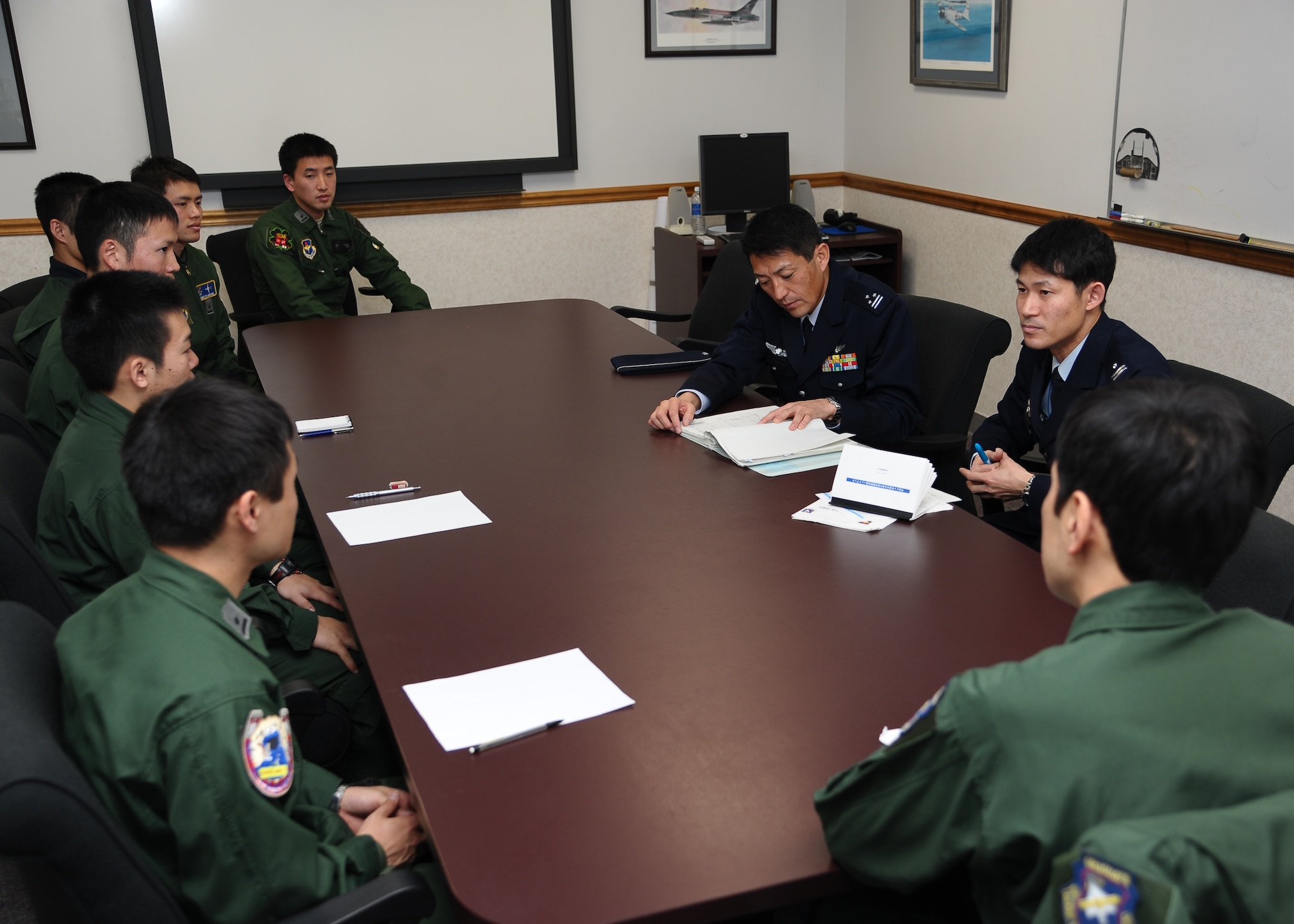Japanese Air Self-Defense Force officers Col. Masaharu Iwaoka and Maj. Satoru Oshima, Personnel and Education Department, speak with Japanese student pilots currently in Specialized Undergraduate Pilot Training at Columbus Air Force Base. The visit gave the JASDF officers a close look at SUPT and how their students are being trained. (U.S. Air Force photo/Senior Airman Chase Hedrick)