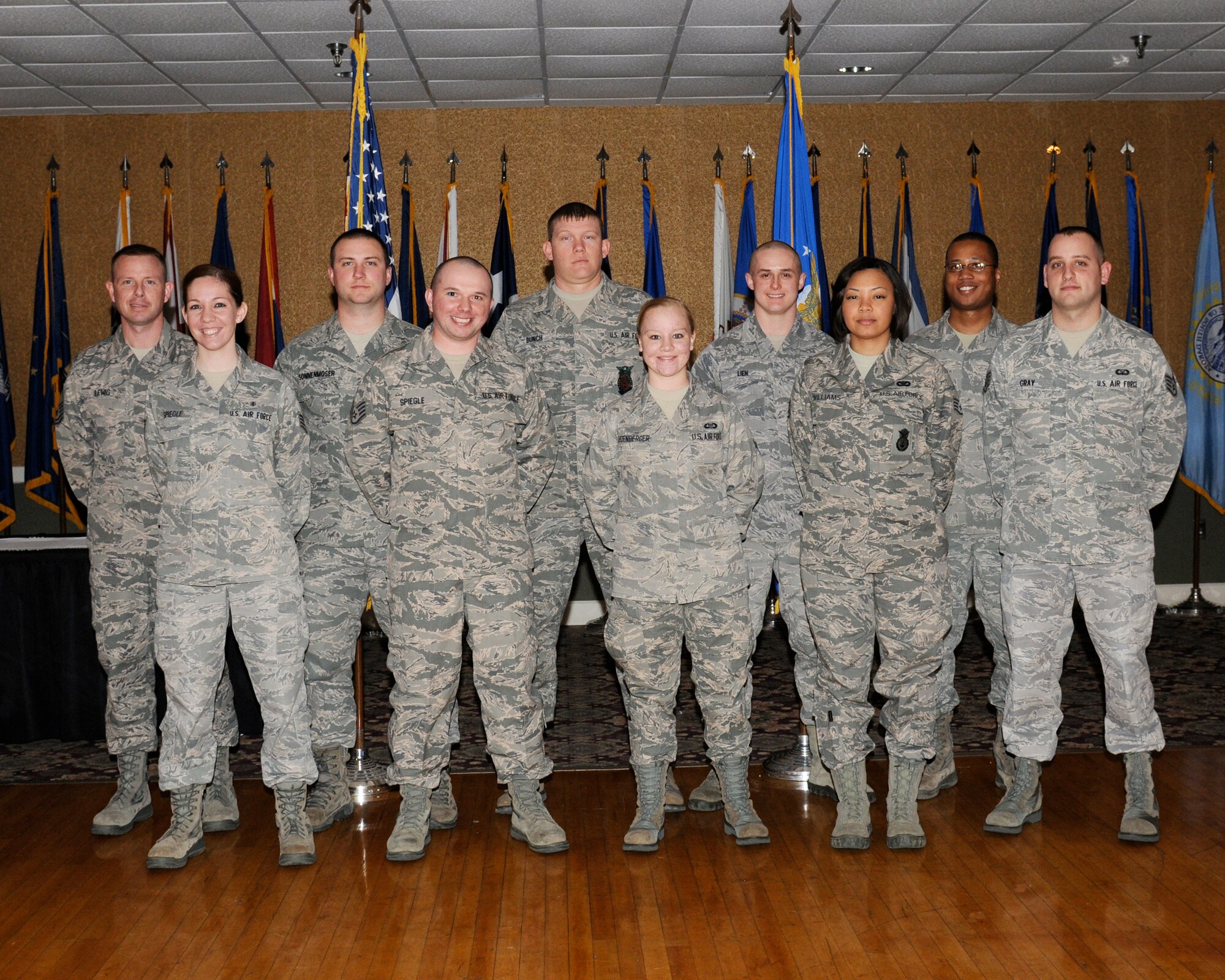Eleven of Team BLAZE’s newly promoted enlisted Airmen sewed on their next stripe at the enlisted promotions ceremony at the Columbus Club on Feb. 28.  (U.S. Air Force Photo/Melissa Duncan)