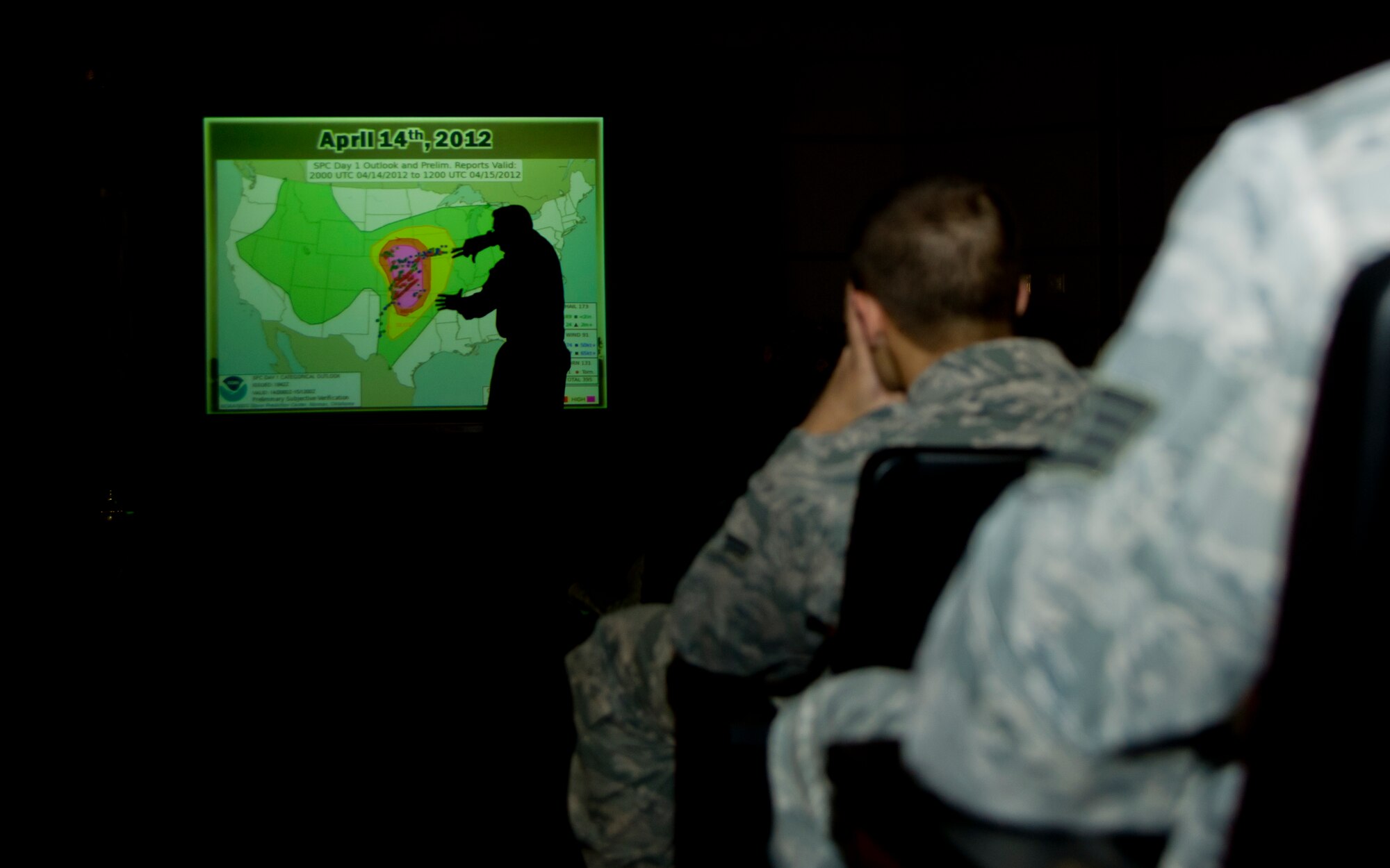Airmen from McConnell AFB listen to Cody Charvat, Sedgwick County Emergency Management training and exercise officer, explains the effects of the April 14, 2012 tornado which hit the Wichita area March 6, 2013, McConnell Air Force Base. The Severe Weather Class was held to inform Team McConnell of the dangerous spring and summer time climate in Kansas. (U.S. Air Force photo/Senior Airman Armando A. Schwier-Morales)