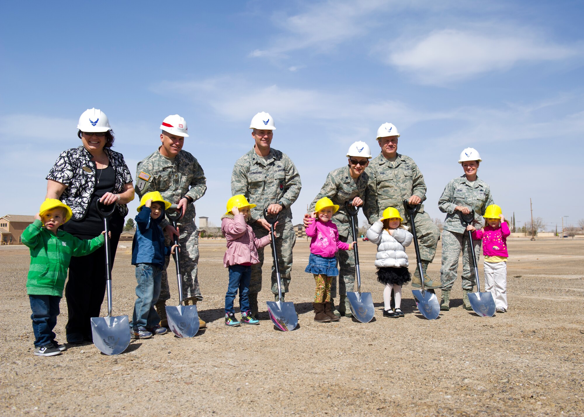 49th Mission Support Group leaders prepare to remove the first shovels of soil from the site that will become the new Child Development Center in a groundbreaking ceremony at Holloman Air Force Base, N.M. March 5. The $11 million project is a collaboration between the 49th MSG and the U.S. Army Corps of Engineers, and is scheduled to be completed by May 2014. The new CDC will have 15 classrooms to accommodate up to 200 children of Holloman AFB servicemembers from six weeks to five years of age. (U.S. Air Force Photo by Airman 1st Class Michael Shoemaker/Released)
