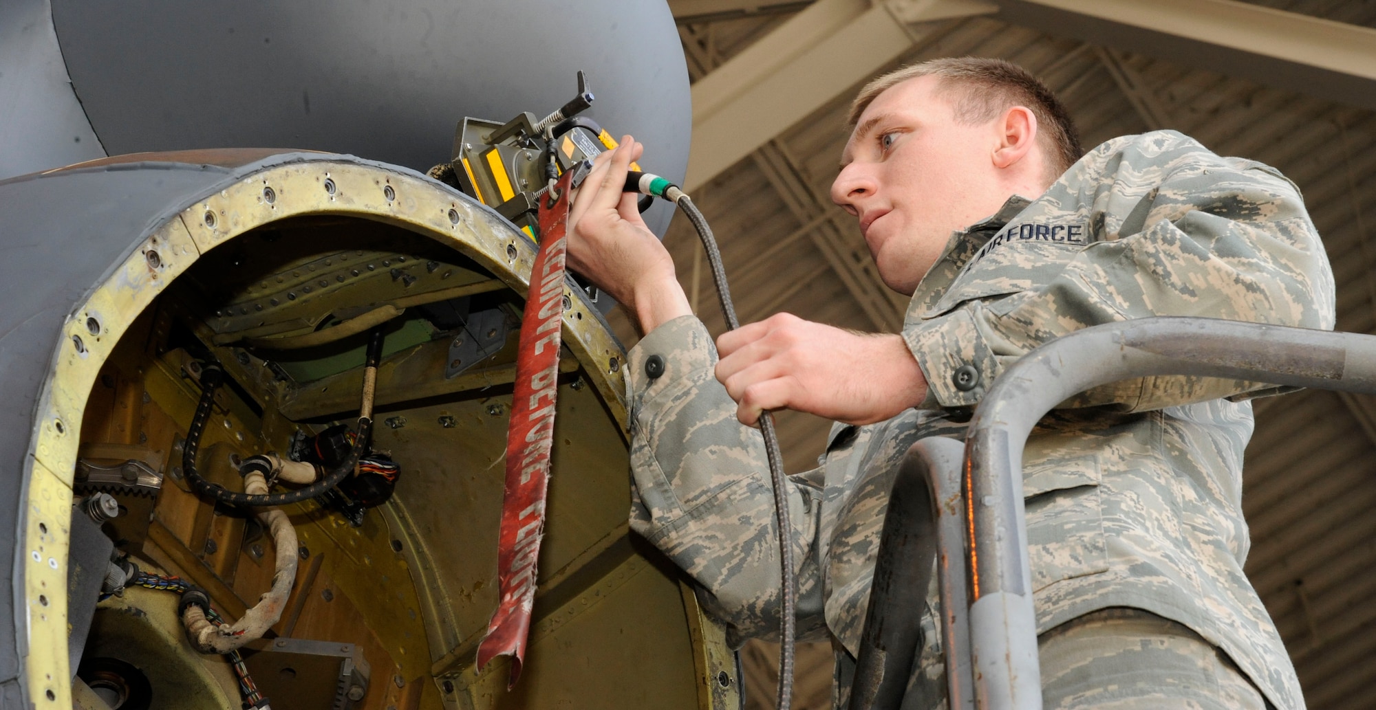Airman 1st Class Sam Ritzman, 2nd Maintenance Squadron Avionics, disconnects a Radio Frequency Interface Unit after testing a B-52H Stratofortress' electronic countermeasure systems on Barksdale Air Force Base, La., March 8. The RFIU assist Avionics Airmen by simulating radar signals to test the aircraft's ECMs. (U.S. Air Force photo/Airman 1st Class Andrew Moua)