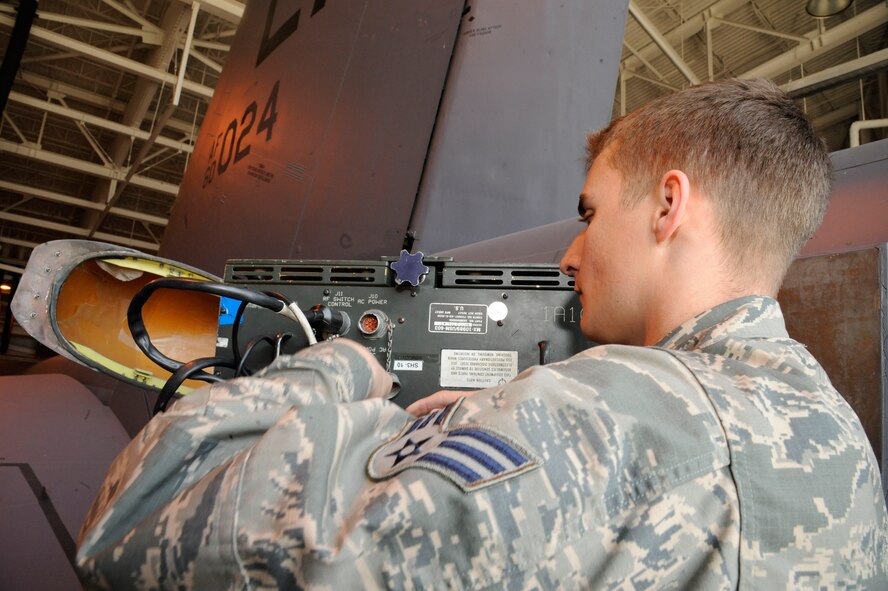 Senior Airman Heinz Bartnick, 2nd Maintenance Squadron Avionics, disconnects a Radio Frequency Interface Unit after testing a B-52H Stratofortress' electronic countermeasure systems on Barksdale Air Force Base, La., March 8. The RFIU assist Avionics Airmen by simulating radar signals to test the aircraft's ECMs. (U.S. Air Force photo/Airman 1st Class Andrew Moua)