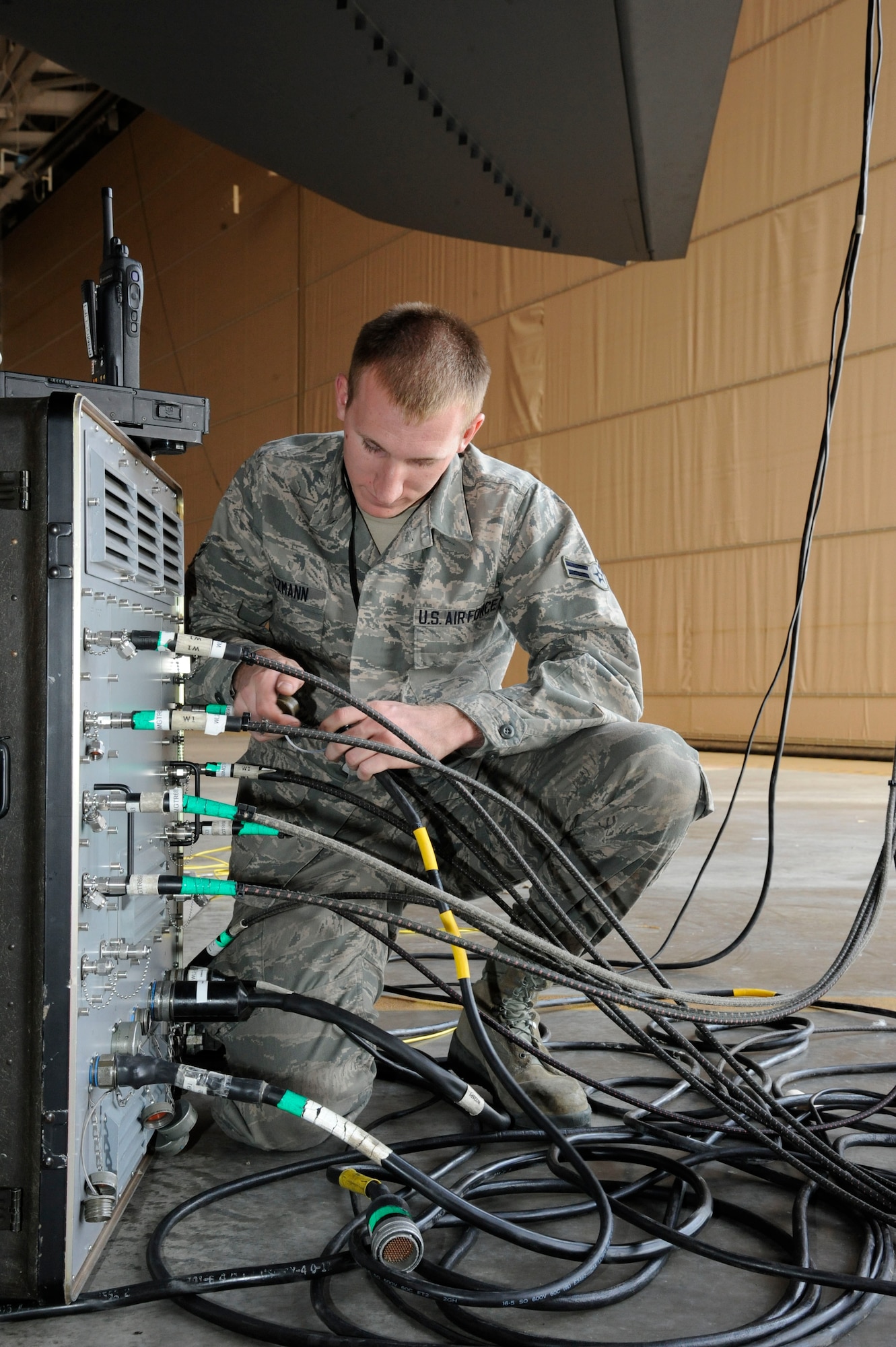Airman 1st Class Sam Ritzman, 2nd Maintenance Squadron Avionics, hooks cables to a test stand during testing of a B-52H Stratofortress' electronic countermeasure systems on Barksdale Air Force Base, La., March 8. ECMs help an aircraft evade and survive hostile fire by disrupting enemy radar and tracking systems. (U.S. Air Force photo/Airman 1st Class Andrew Moua)