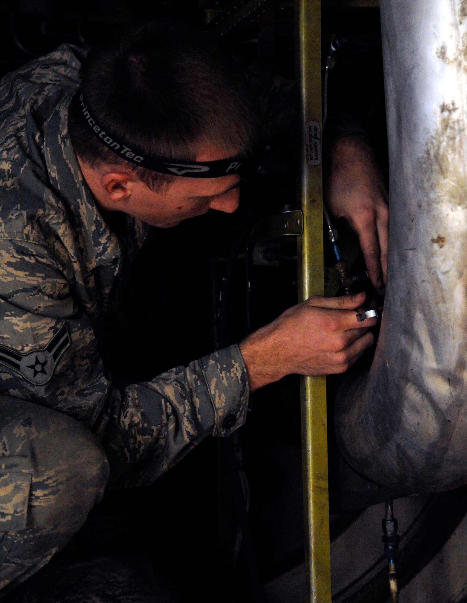 Airman 1st Class Sam Ritzman, 2nd Maintenance Squadron Avionics, conducts a pressure test on a B-52H Stratofortress' electronic countermeasure systems on Barksdale Air Force Base, La., March 8. The pressure test checks for the proper pressure levels within the ECMs as the system needs a certain amount of pressure to keep moisture and dirt out which could cause damage. (U.S. Air Force photo/Airman 1st Class Andrew Moua)