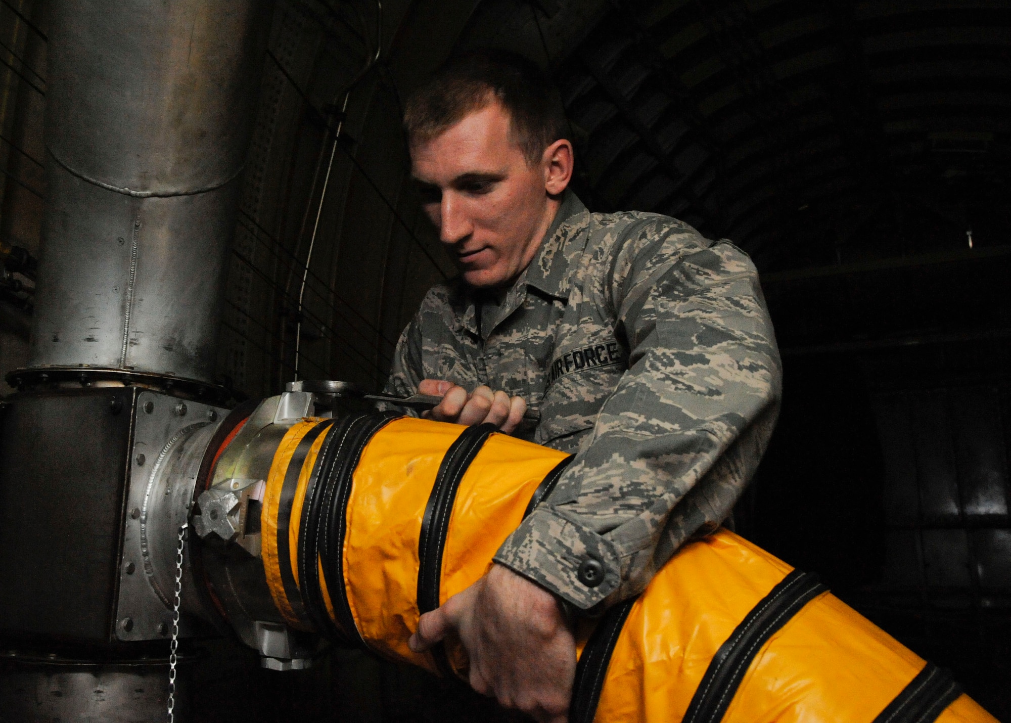 Airman 1st Class Sam Ritzman, 2nd Maintenance Squadron Avionics, disconnects a cooling tube for a 172 Automatic Jamming System on a B-52H Stratofortress during tests of its electronic countermeasure systems on Barksdale Air Force Base, La., March 8. Avionics Airmen maintain the delicate systems such as radar, communication/navigation and flight controls. (U.S. Air Force photo/Airman 1st Class Andrew Moua)