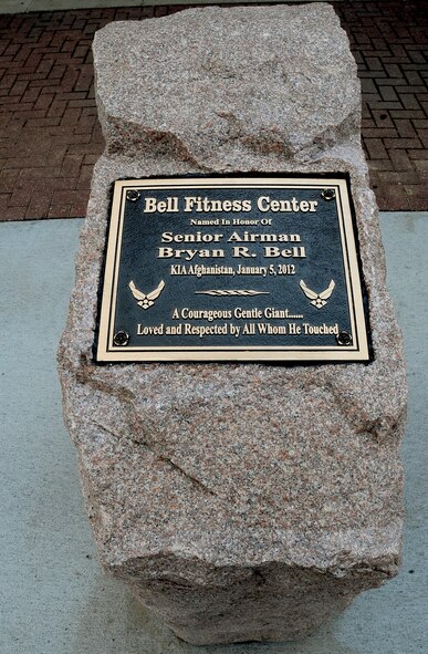 Family of the late Senior Airman Bryan Bell, 2nd Civil Engineer Squadron Explosive Ordnance Disposal flight, unveiled a plaque in honor of Bell during a dedication ceremony at the SrA Bryan Bell Fitness Center on Barksdale Air Force Base, La., March 8. Bell, a member of the 2nd Civil Engineer Squadron Explosive Ordnance Disposal flight, was killed in action in Afghanistan by an improvised explosive device in 2012 while supporting Operation Enduring Freedom. (U.S. Air Force/Staff Sgt. Amber Ashcraft)
