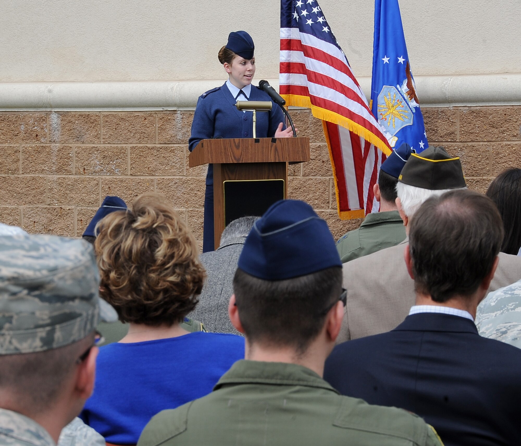 Senior Airman Candice Bell, Wright Patterson Air Force Base, Ohio, speaks to the crowd about her late brother, Senior Airman Bryan Bell, 2nd Civil Engineer Squadron Explosive Ordnance Disposal flight, during a dedication ceremony to re-name the Fitness Center to the SrA Bryan Bell Fitness Center on Barksdale Air Force Base, La., March 8. Bell was killed in action in Afghanistan by an improvised explosive device in 2012 while supporting Operation Enduring Freedom. (U.S. Air Force/Staff Sgt. Amber Ashcraft)