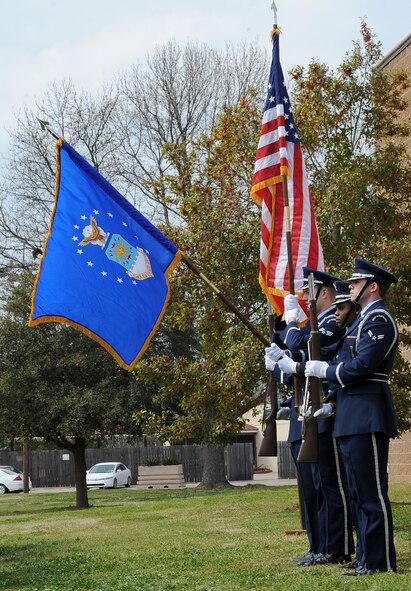 Barksdale Honor Guard members present the colors during a dedication ceremony to re-name the Fitness Center to the SrA Bryan Bell Fitness Center on Barksdale Air Force Base, La., March 8. Bell, a member of the 2nd Civil Engineer Squadron Explosive Ordnance Disposal flight, was killed in action in Afghanistan by an improvised explosive device in 2012 while supporting Operation Enduring Freedom. (U.S. Air Force/Staff Sgt. Amber Ashcraft)