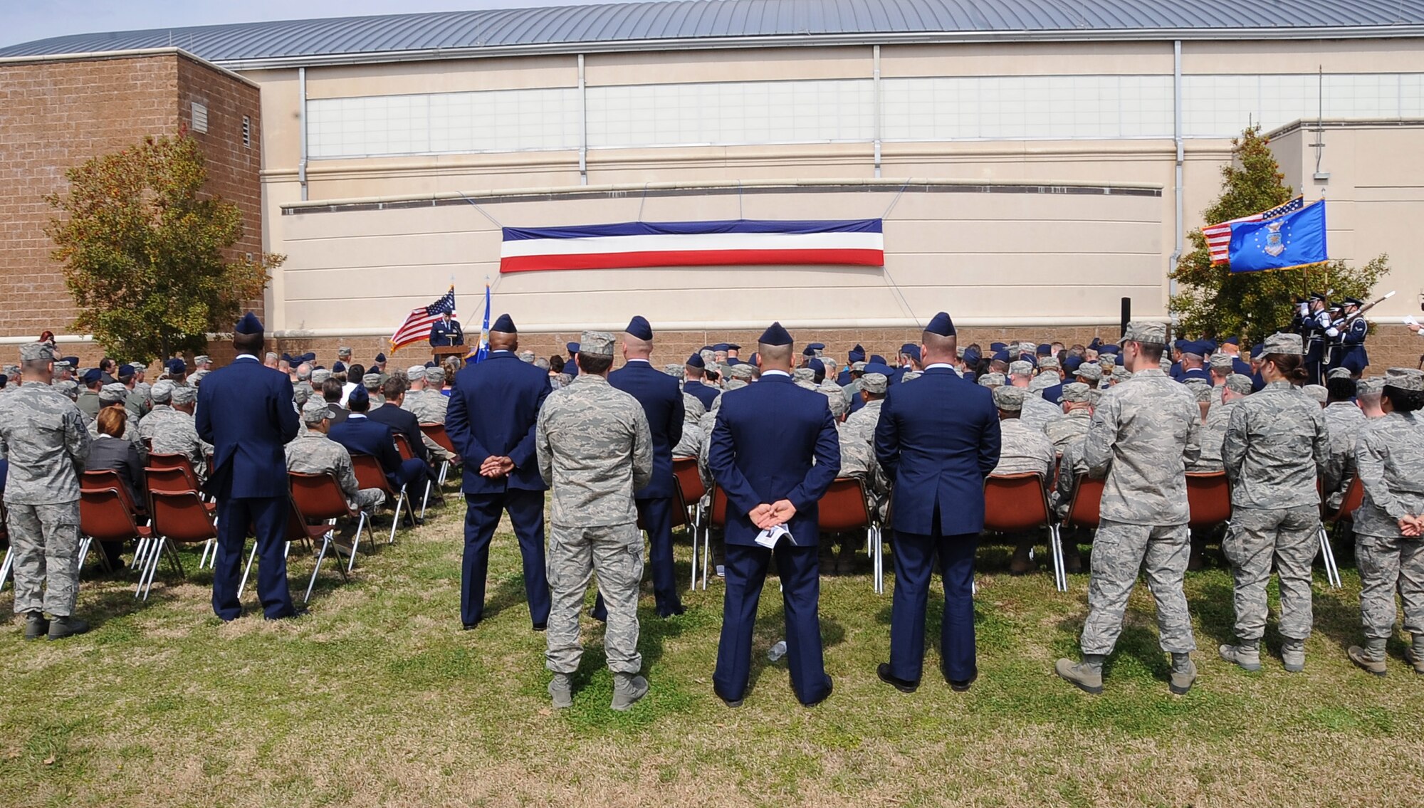 Airmen along with the family and friends of the late Senior Airman Bryan Bell, 2nd Civil Engineer Squadron Explosive Ordnance Disposal flight, gathered during a dedication ceremony to re-name the Fitness Center to the SrA Bryan Bell Fitness Center on Barksdale Air Force Base, La., March 8. Bell was killed in action in Afghanistan by an improvised explosive device in 2012 while supporting Operation Enduring Freedom. (U.S. Air Force/Staff Sgt. Amber Ashcraft)