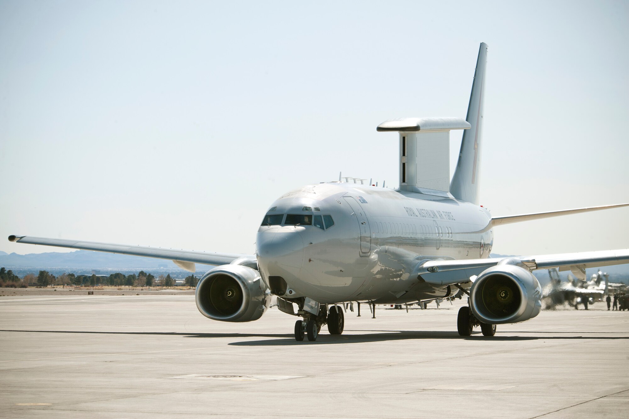 A Royal Australian Air Force E-7A Airborne Early Warning and Control aircraft taxis to the active Nellis Air Force Base, Nev., runway Feb. 27, 2013. The RAAF E-7A pilots, maintainers and support members are participating in Red Flag for the first time. (U.S. Air Force photo by Lawrence Crespo)