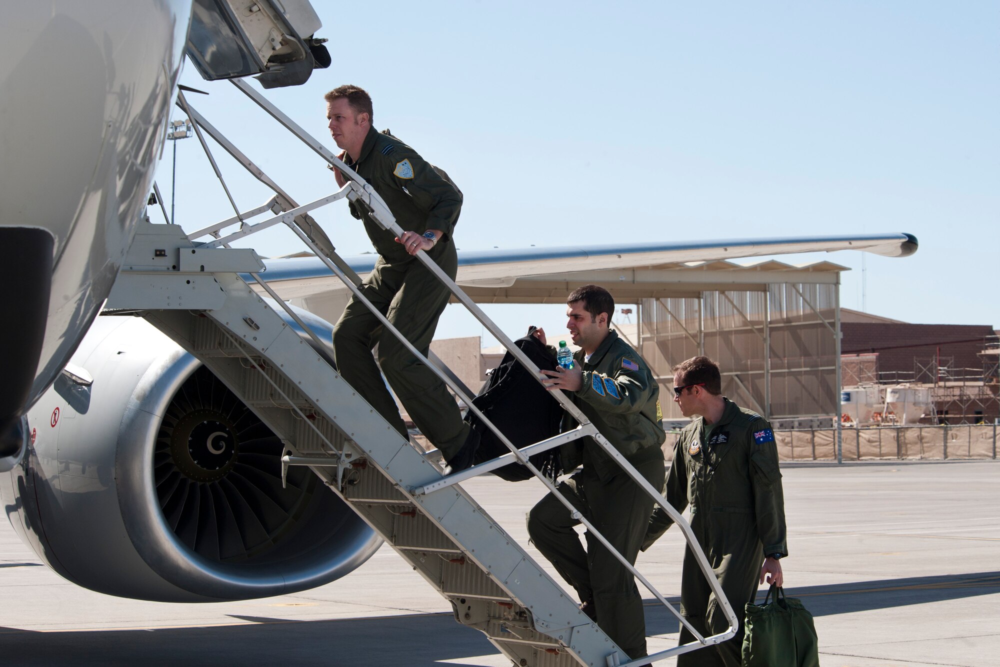 Royal Australian Air Force No. 2 Squadron aircrew members board an E-7A Wedgetail aircraft prior to a Red Flag training mission at the Nellis Air Force Base, Nev. Feb. 27, 2013. The RAAF participation in the U.S. Air Force's Red Flag exercise builds international air force cooperation, inter-operability and mutual support. (U.S. Air Force photo by Lawrence Crespo)