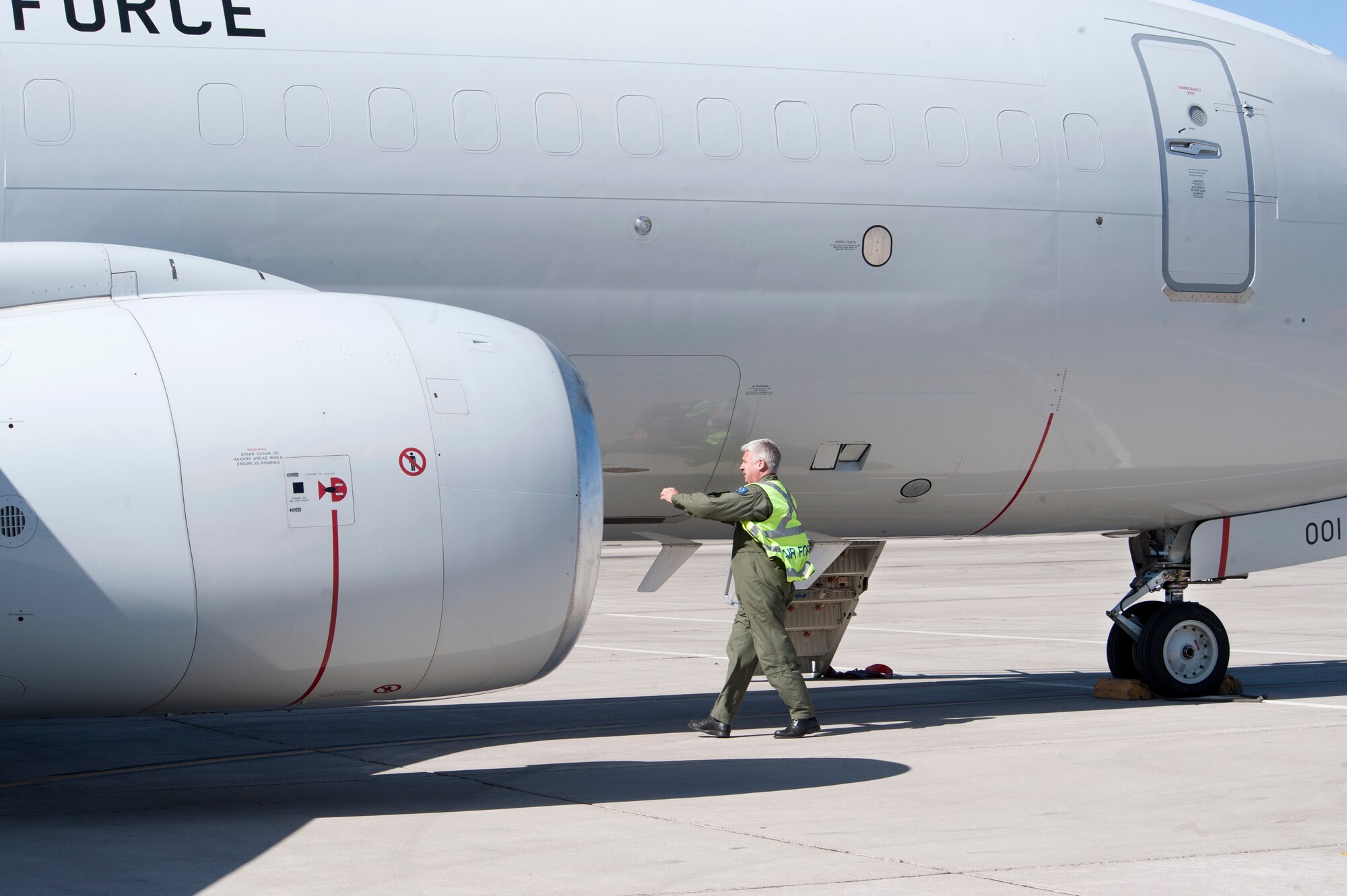 Royal Australian Air Force Aircraft Capt. (Maj.) James Pierson, No. 2 Squadron air crew member, performs a pre-flight inspection on an E-7A Wedgetail aircraft prior to a Red Flag training mission at the Nellis Air Force Base, Nev. Feb. 27, 2013. The RAAF E-7A is participating in Red Flag 13-3 to maximize air command and control battle management readiness in a realistic training environment. (U.S. Air Force photo by Lawrence Crespo)