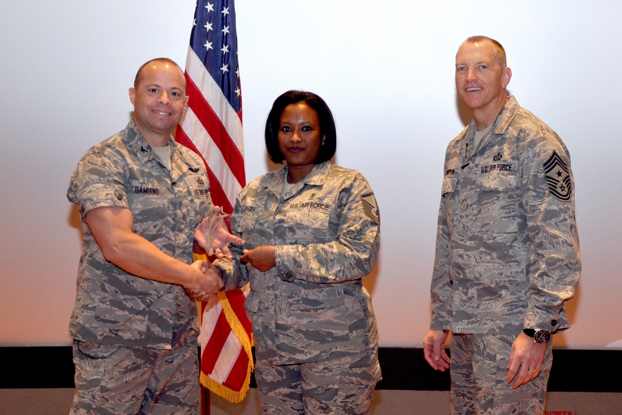 GOODFELLOW AIR FORCE BASE, Texas— Col. Mark Damiano, 17th Training Wing Commander, presents the 2012 Lance P. Sijan USAF Leadership, Senior Enlisted Category award to Master Sgt. Kaleah Hodges, 17th TRW Wing Staff, during the 17th TRW Commander’s Call at the base theater, March 7. (U.S. Air Force photo/1st Lt. Leanne Hedgepeth) 
