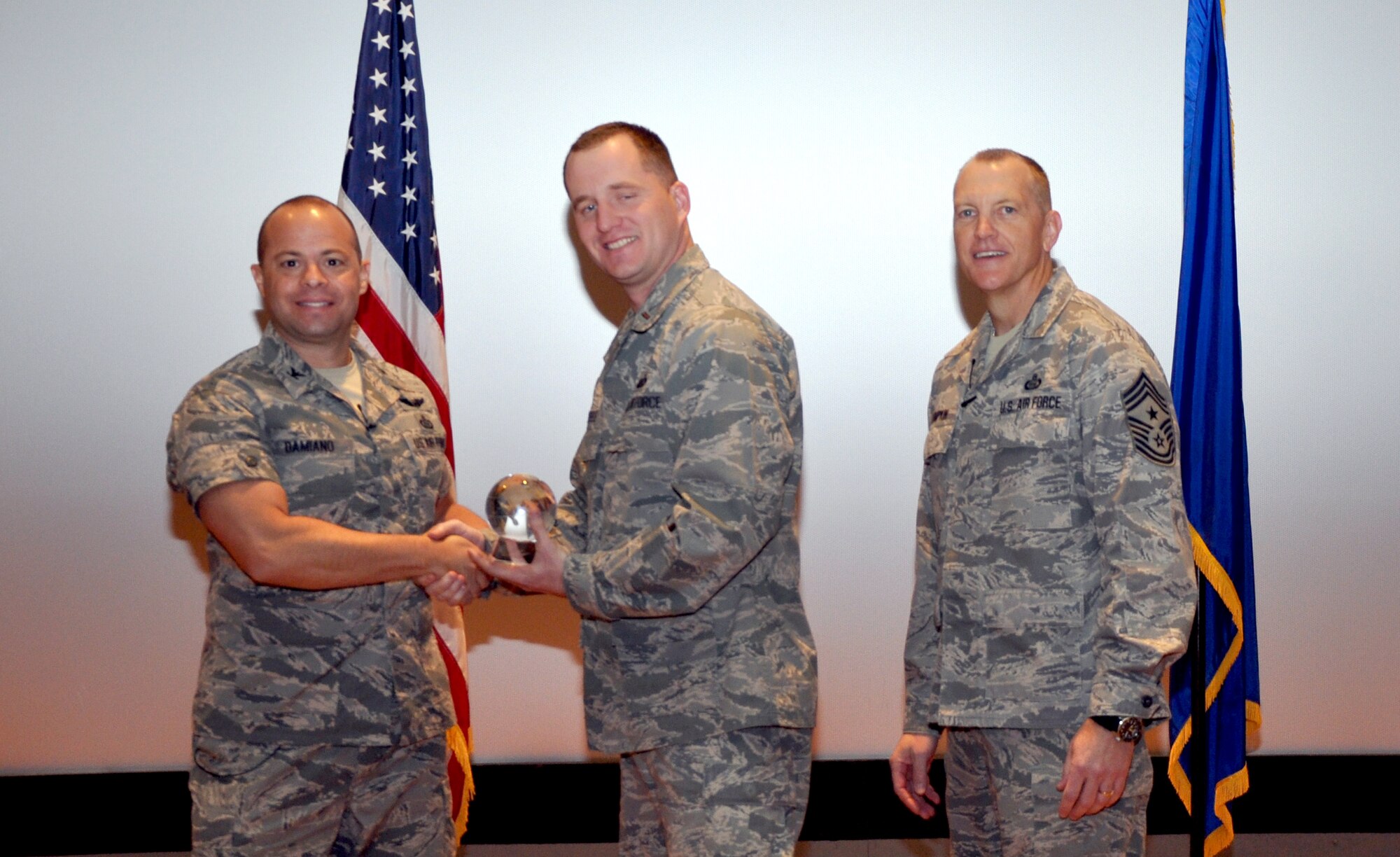 GOODFELLOW AIR FORCE BASE, Texas—Col. Mark Damiano, 17th Training Wing Commander, presents the Air Education and Training Command Outstanding Resource Management Team award to the 17th Medical Support Squadron during the 17th TRW Commander’s Call at the base theater, March 7. Accepting the award is 2nd Lt. Matthew Steele. (U.S. Air Force photo/1st Lt. Leanne Hedgepeth) 