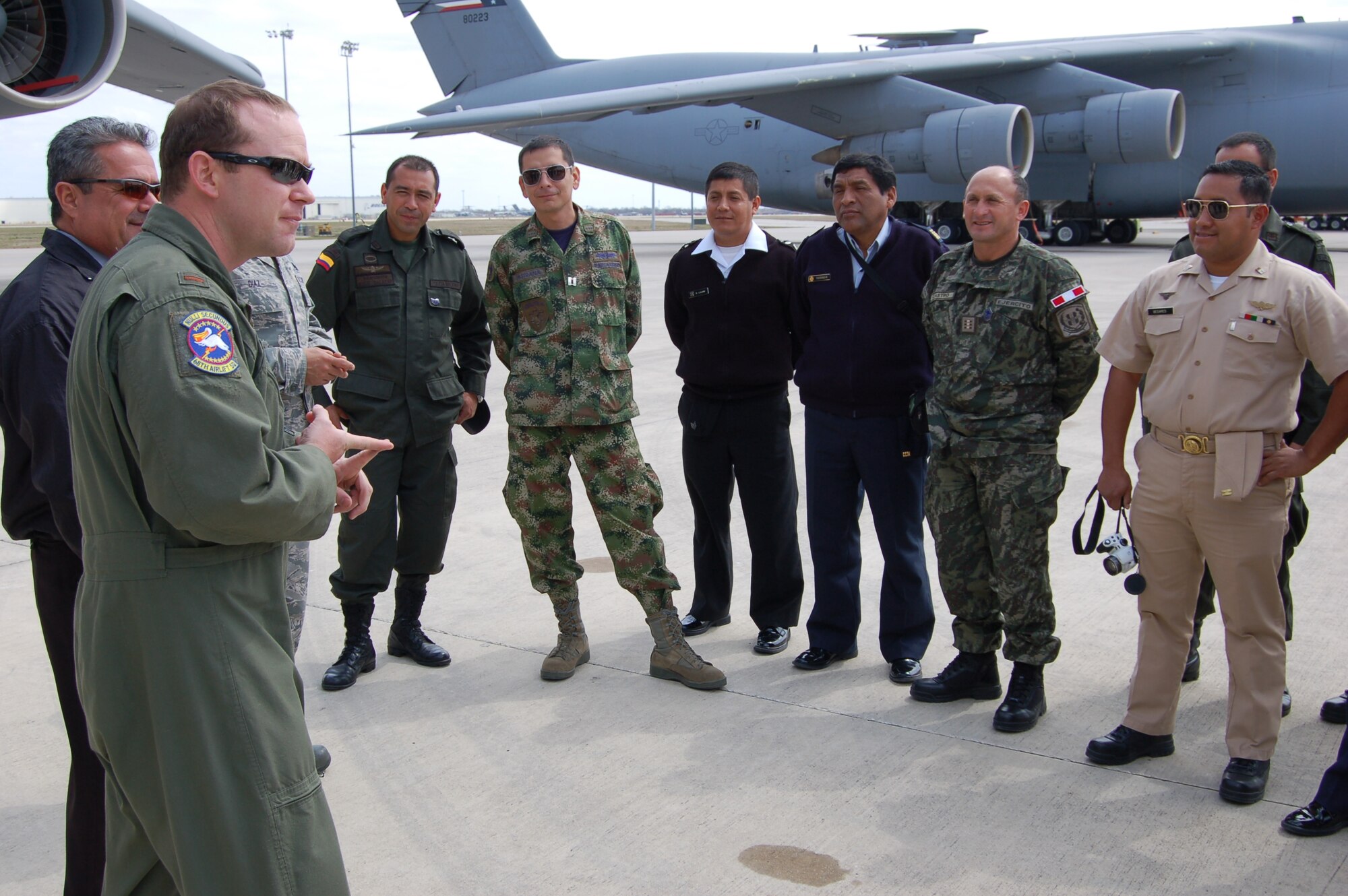 Second Lt. Mike Blakley, C-5A Galaxy pilot with the 68th Airlift Squadron, answers questions about the mammoth jet from students of the Inter-American Air Forces Academy who visited the "Alamo Wing" on March 7. The 68th AS is one of two flying squadrons that belong to the 433rd Operations Group of the 433rd Airlift Wing, a C-5A equipped, Air Force Reserve unit also located at JBSA-Lackland. (U.S. Air Force photo by Elsa Martinez)
