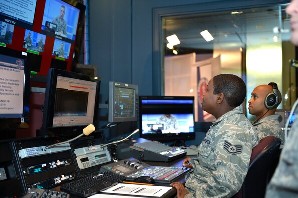 McGHEE TYSON AIR NATIONAL GUARD BASE, Tenn. – Staff Sgt. Chalanda Roberts, TEC/TV broadcast journalist, manages a switch board and Master Sgt. John A. Anderson, right, TEC/TV broadcast operations manager, handles camera placements during a live broadcast of Chief Master Sgt. Michael Kennedy, the first sergeant functional manager for the Air National Guard. Kennedy spoke interactively with more than 800 First Sergeants via the Warrior Network at the I. G. Brown Training and Education Center here, March 7, 2013. (National Guard photo by Master Sgt. Kurt Skoglund)