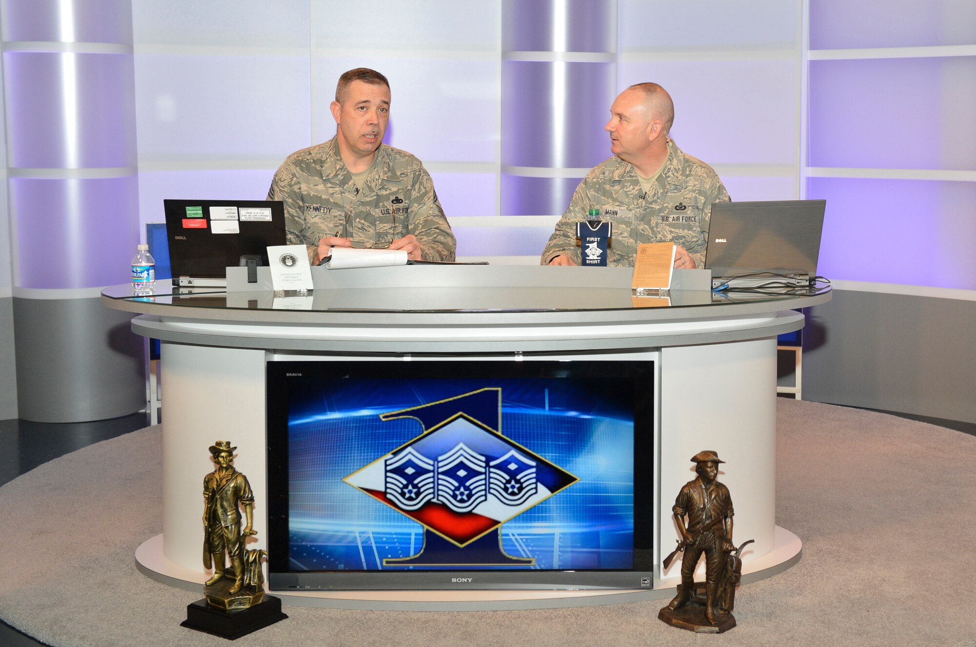 McGHEE TYSON AIR NATIONAL GUARD BASE, Tenn. – Chief Master Sgt. Michael Kennedy, the first sergeant functional manager for the Air National Guard speaks interactively with more than 800 First Sergeants from the I. G. Brown Training and Education Center here, March 5, 2013. The live broadcast, via the Warrior Network was part of their continuous development training. Also pictured, Senior Master Sgt. Paul A. Mann, public affairs branch chief at TEC/TV. (National Guard photo by Master Sgt. Kurt Skoglund)