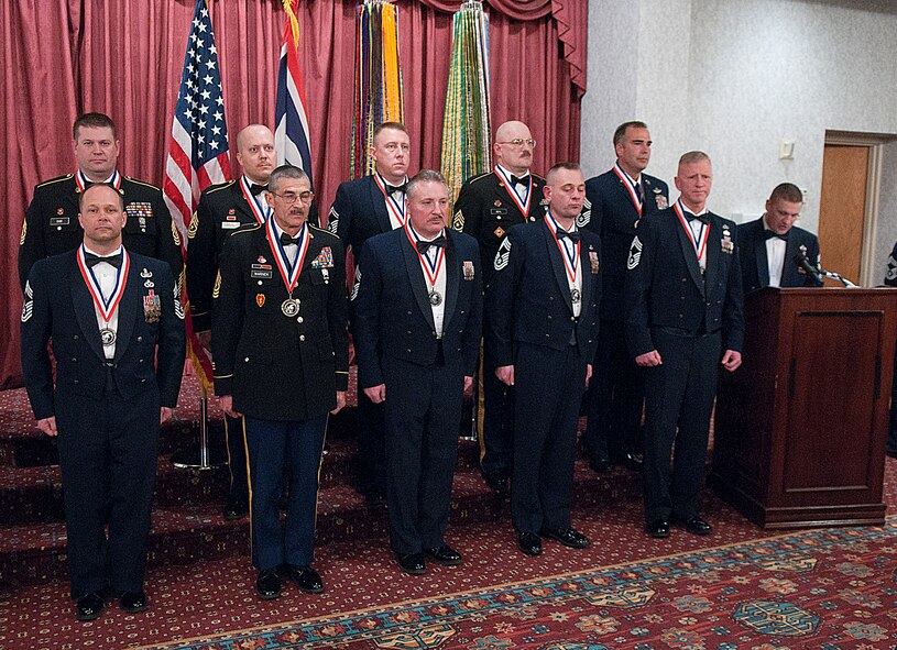 Newly inducted chief master sergeants and sergeants major stand at attention in the Trail’s End Club March 1 as Chief Master Sgt. Michael Garrou, 90th Missile Wing command chief, gives his remarks during the induction ceremony. The induction ceremony paid tribute to those assigned to F. E. Warren Air Force Base, Wyo., the Wyoming Air National Guard and the Wyoming Army National Guard who have been promoted to the rank of E-9.

Inductees:
Chief Master Sgt. Jack Goeken, 187th Airlift Squadron
Chief Master Sgt. Scott Hasert, 153rd Communications Flight
Chief Master Sgt. Leroy Rusk, 153rd Civil Engineer Squadron
Chief Master Sgt. Gary Underwood, 90th Civil Engineer Squadron
Senior Master Sgt. Marc Vogt, 90th Maintenance Group
Chief Master Sgt. Bill Whipple, 153rd Maintenance Group
Sgt. Maj. Mark Beyl, 115th Fires Brigade
Sgt. Maj. Thad Ehde, 94th Troop command
Sgt. Maj. James Shreve, Joint Forces Headquarters
Sgt. Maj. Michael Warner, Headquarters and Headquarters Battery, 2/300th Field Artillery Battalion (U.S. Air Force photo by R.J. Oriez)