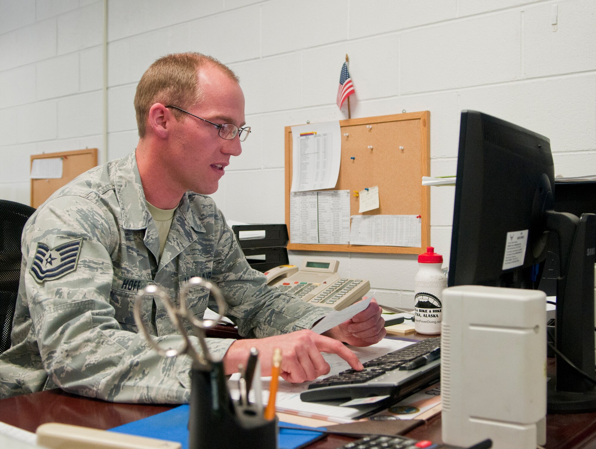 Tech. Sgt. James Hoff, 90th Logistics Readiness Squadron vehicle management and analysis, uploads vehicle purchase data in Bldg. 1245 March 4. Vehicle management analysis technicians coordinate part buying for 90th LRS vehicle maintenance operations. (U.S. Air Force photo by Airman 1st Class Jason Wiese)