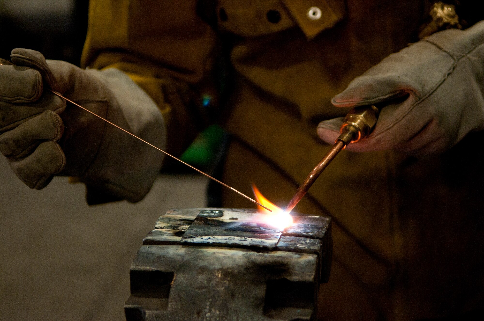 Airman 1st Class Alexander Pizarro, 90th Logistics Readiness Squadron multipurpose vehicle mechanic, trains by welding pieces of metal together in Bldg. 1245 March 4. Pizarro underwent allied trade learning to learn to weld; one of his job’s core tasks. (U.S. Air Force photo by Airman 1st Class Jason Wiese)